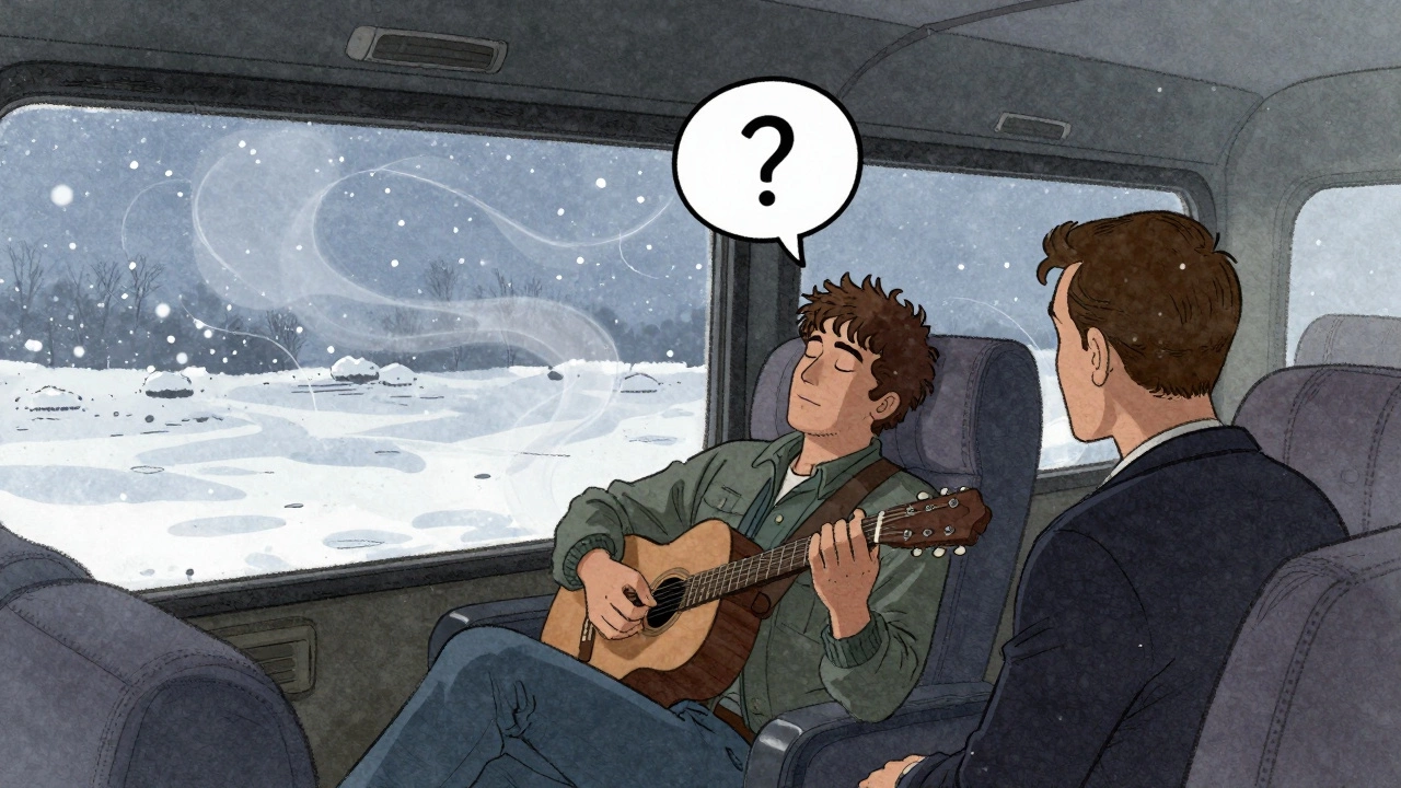 Musician in a tour bus, quiet and reflective, while a journalist sits silently across from them.