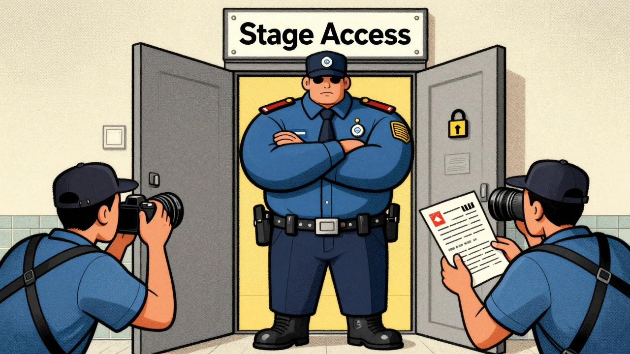 Security blocking access while photographers wait outside
